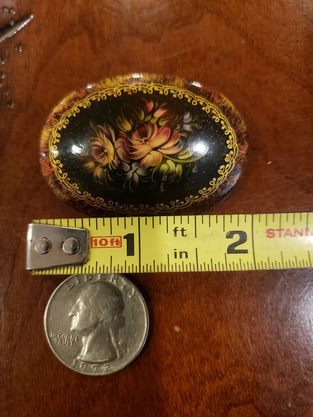 Vintage '96 Oval Black Floral Brooch with Gold Accents